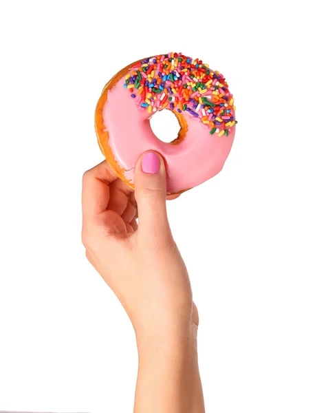 Donut com polvilhas na mão isolado sobre fundo branco — Fotografia de Stock