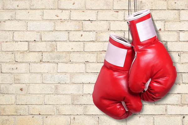 Luvas de boxe sobre tijolo parede fundo — Fotografia de Stock