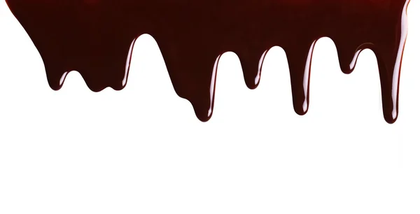 Beyaz izole eritilmiş çikolata damlama — Stok fotoğraf