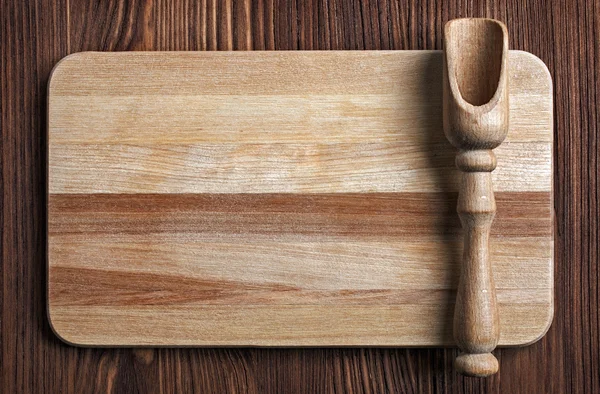 Wooden kitchen utensils on a wooden table — Stock Photo, Image