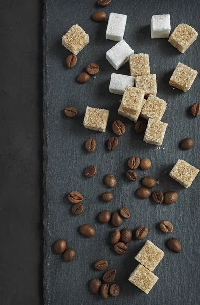 Sugar cubes and coffee beans — Stock Photo, Image