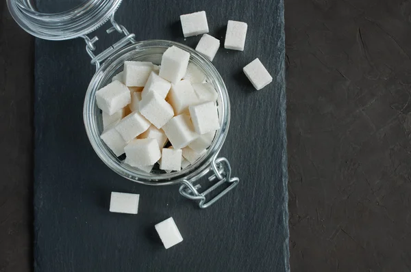 White cubes sugar in a glass jar — Stock Photo, Image