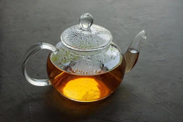 Glass teapot with hot tea — Stock Photo, Image