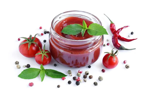 Tomato sauce and basil in glass jar — Stock Photo, Image