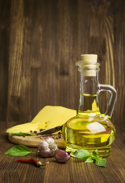 Sunflower oil in a bottle , cheese and spices — Stock Photo, Image