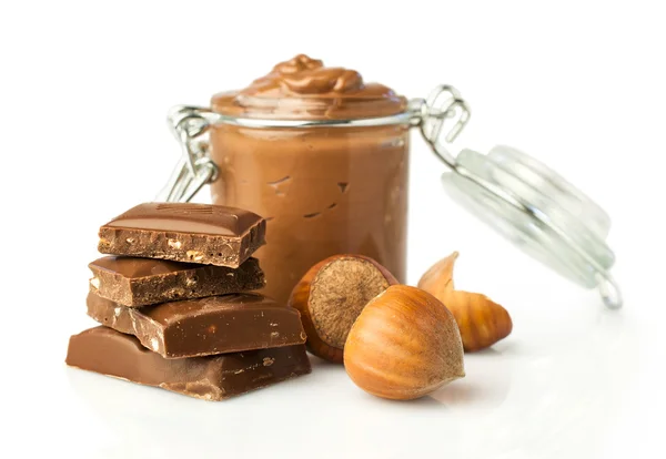 Nut butter and chocolate with hazelnuts — Stock Photo, Image