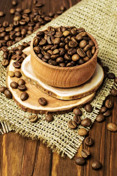 Roasted coffee beans in wooden bowl — Stock Photo, Image