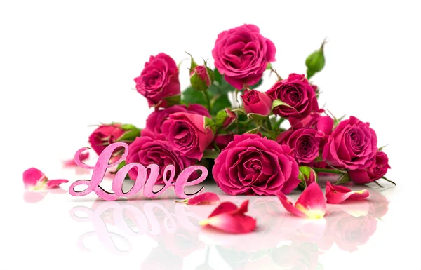 Bouquet of roses and word "love" — Stock Photo, Image