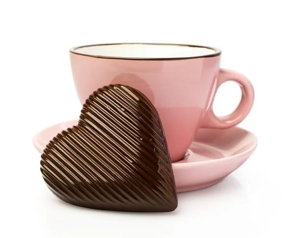 Pink cup with chocolate hearts — Stock Photo, Image