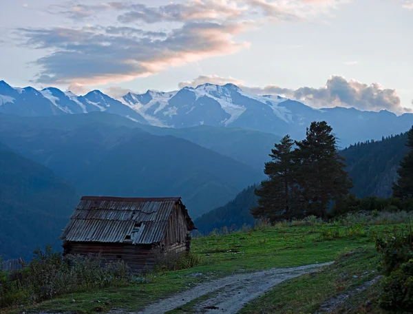 Mountain with wooden hut — Stock Photo, Image