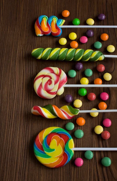 Colored candies on a wooden — Stock Photo, Image
