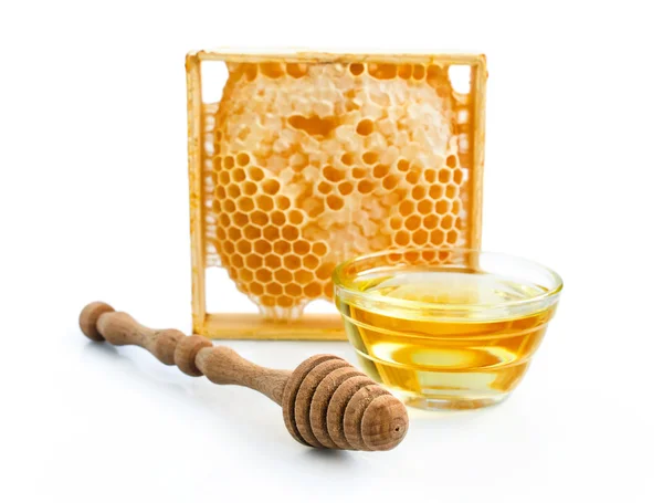 Pente de mel e mergulhador de madeira — Fotografia de Stock