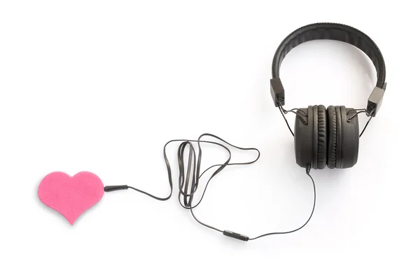 Concept with headphones and pink heart — Stock Photo, Image