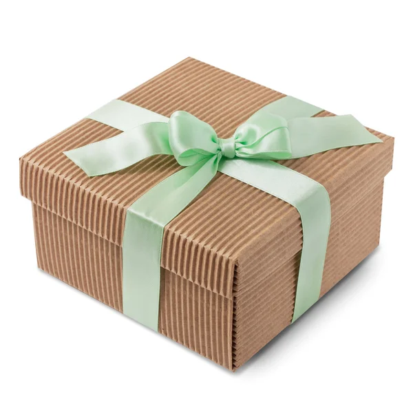 Present kartong förpackade grönt band med pastellfärgade rosett Stockbild