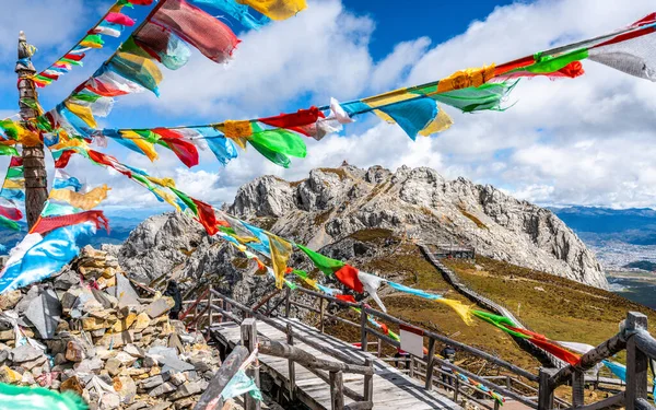 Shika snow mountain summit and Tibetan Buddhist prayer flags view in Shangri-La Yunnan China