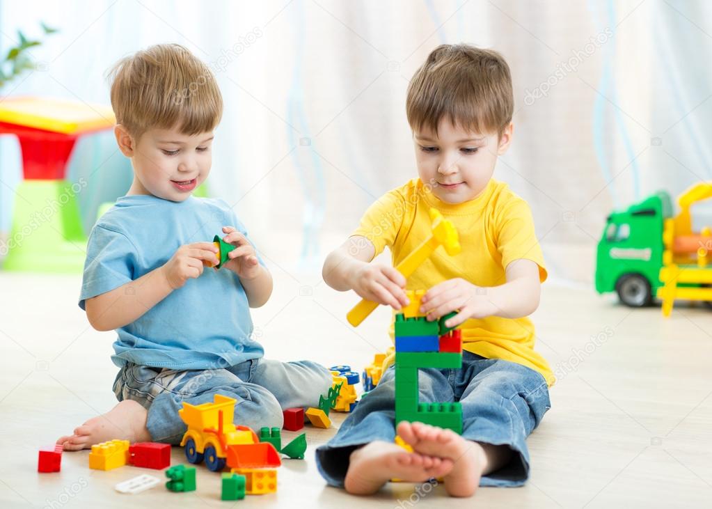 Kids playing toys in playroom at nursery ⬇ Stock Photo, Image by