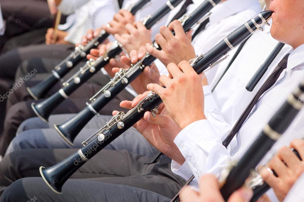 Musicians playing clarinet in street orchestra