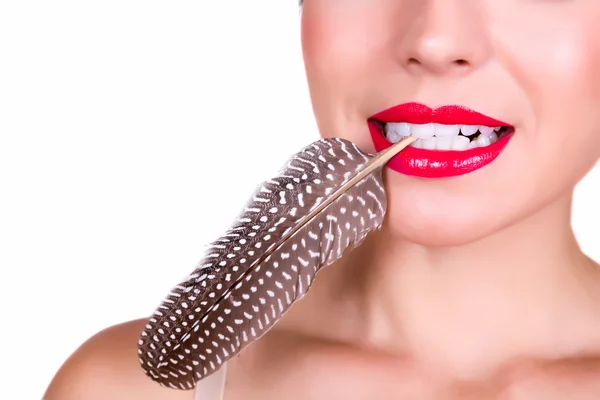 Red lips and a feather — Stock Photo, Image
