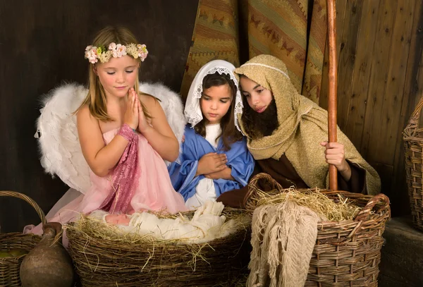 Little angel in nativity scene — Stock Photo, Image