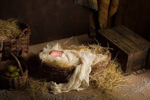 Baby doll in nativity scene