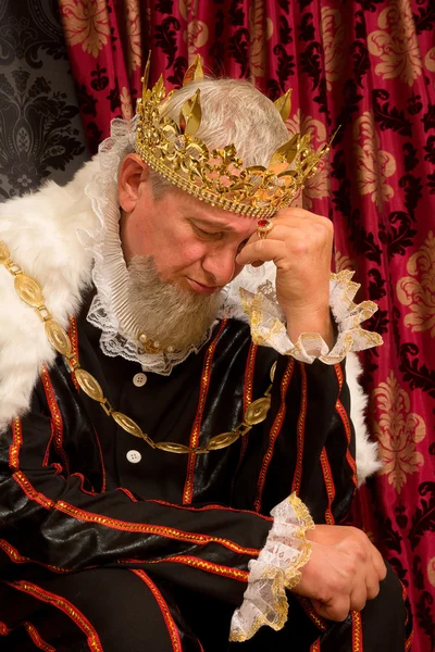 Worried king on throne — Stock Photo, Image