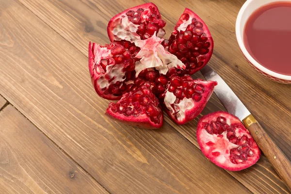 Pomegranate on table — Stock Photo, Image