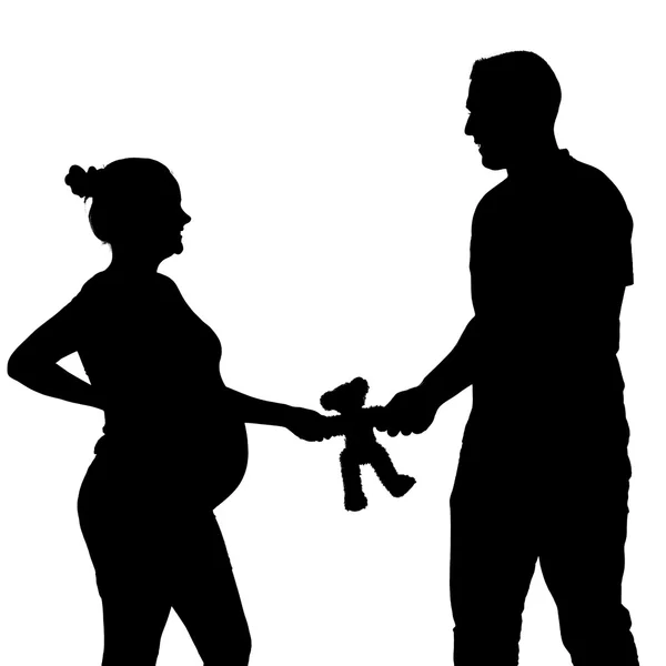 Pregnant silhouette with teddy bear — Stock Photo, Image