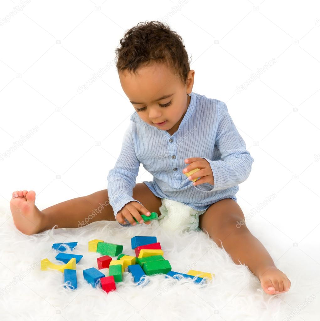 African toddler with blocks