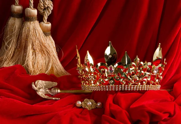 Crown and scepter on red velvet — Stock Photo, Image