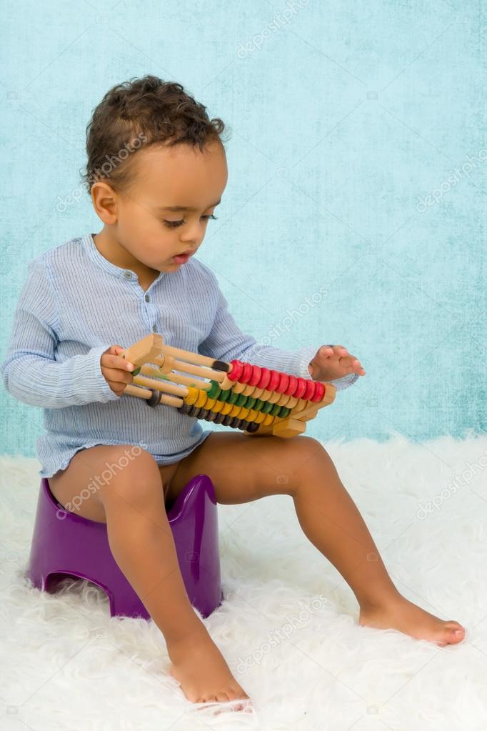 African toddler on potty