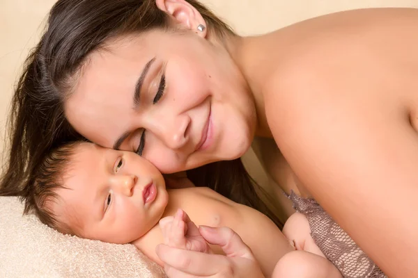 Mother hugging newborn — Stock Photo, Image