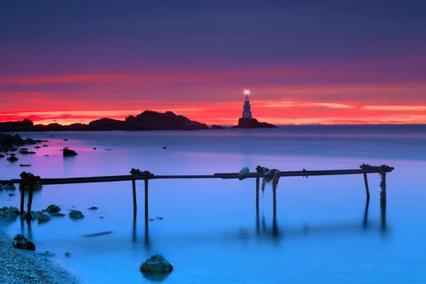 Lighthouse yakınındaki gündoğumu — Stok fotoğraf