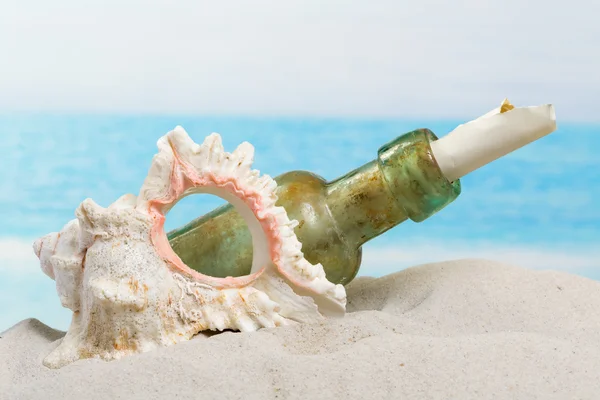 Bottle with message on beach — Stock Photo, Image