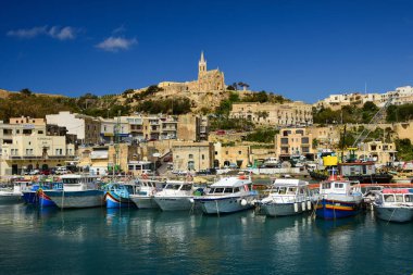 Mgarr Harbour in Gozo with the Church of the Madonna of Lourdes on the hilltop, Malt clipart