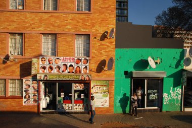 A barber in Johannesburg, the largest city in South Africa clipart
