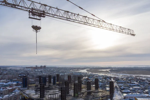 monolithic house at the stage of construction of a monolithic fill, photographed from a flying drone at sunset