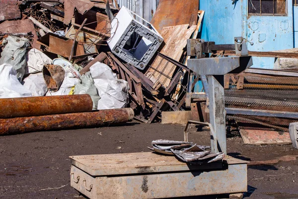 scrap metal collection point with floor scales in early spring during the steel price increase season