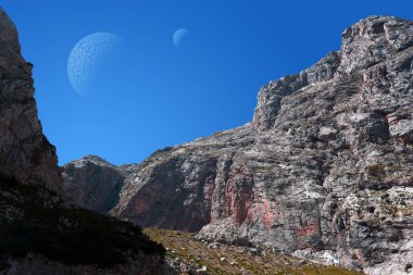 Kayalık bir vadisi ve gökyüzünde iki uydusu olan dünya dışı fantastik bir manzara.