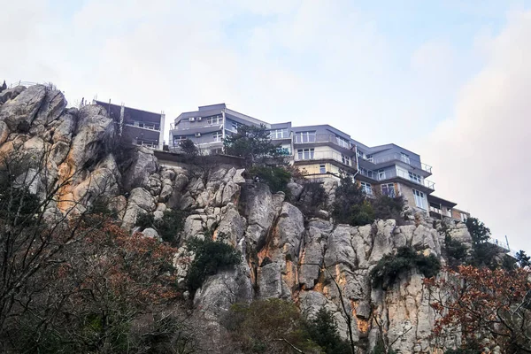 modern architecture - townhouses are built over a cliff and fit into the landscape