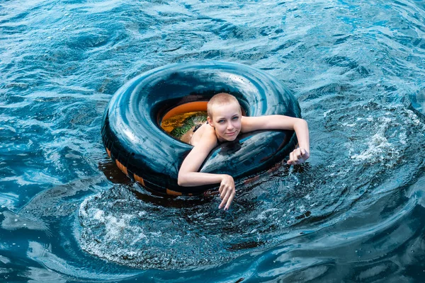 Happy Teen Girl Swimming Using Swim Tube — Stock Photo, Image