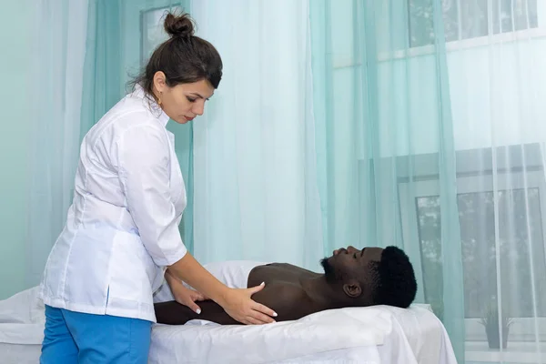 Woman Masseuse Doing Massage Shoulder Area Hand Black Man — Stock Photo, Image