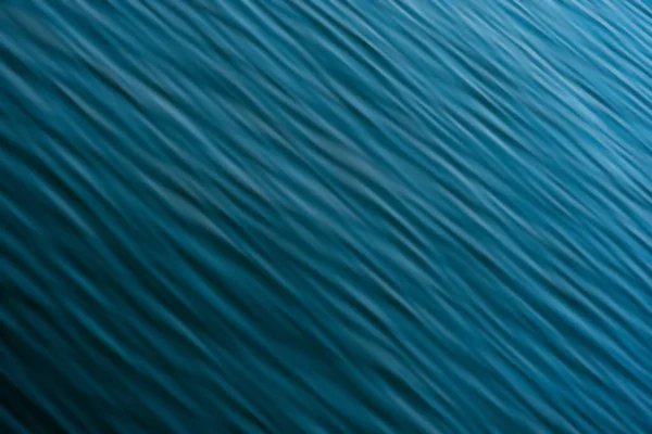 带波浪的模糊的抽象蓝水背景 — 图库照片