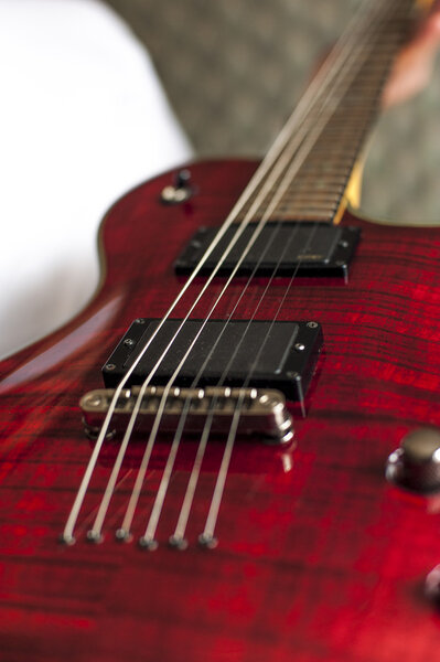 Red electric guitar, closeup