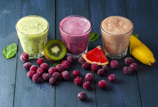 Fruit and berry smoothie on wood table — Stok Foto