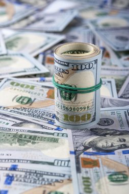 Dolar dolar faturaları arka plan üzerinde rulo