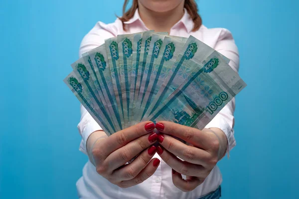 Happy young emotional caucasian woman with rubles