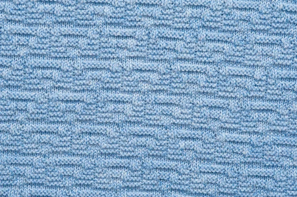 Close-up fragment of warm knitted blue sweatshirts. Concept of warm everyday things. clothing store concept. Advertising space Stock Photo