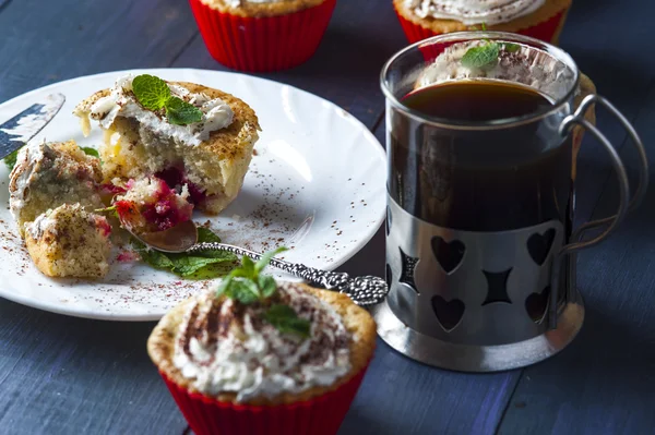 Cupcake with cherry and pineapple on white plate — Stok fotoğraf