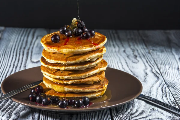 Stack of homemade pancakes with butter and honey — Stock Photo, Image