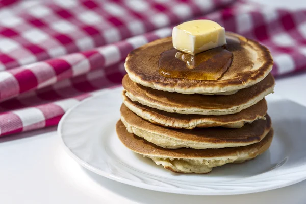 Stack of homemade pancakes with butter and honey — Stock Photo, Image